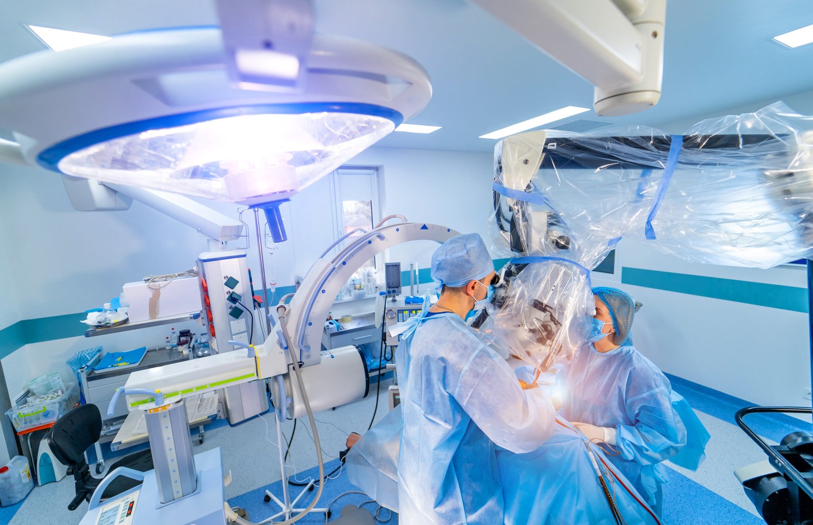 Doctor performs minimally-invasive surgery using robotic surgery systems and endoscopic tools in a high-tech medical robotics integration