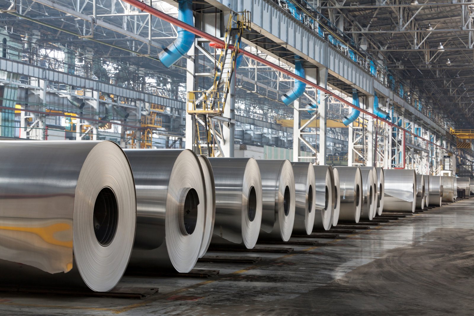 Automated robotic arm operating in a steel and metal production facility
