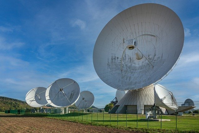 Satellite dishes representing modern communication infrastructure, showcasing the role of automation in telecommunications for seamless global connectivity.